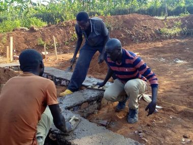 Workers building foundation